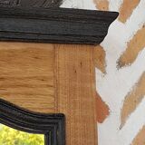 Black mirror and raw natural wood