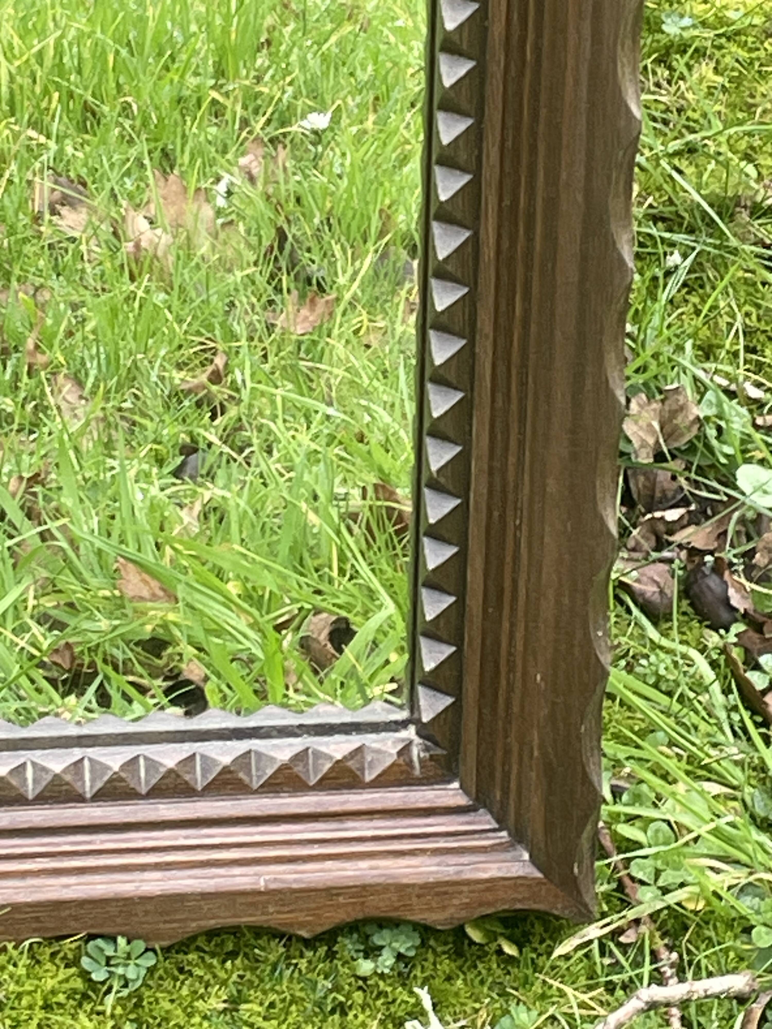 Rustic mirror called brutalist, molded carved natural wood