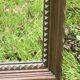 Rustic mirror called brutalist, molded carved natural wood