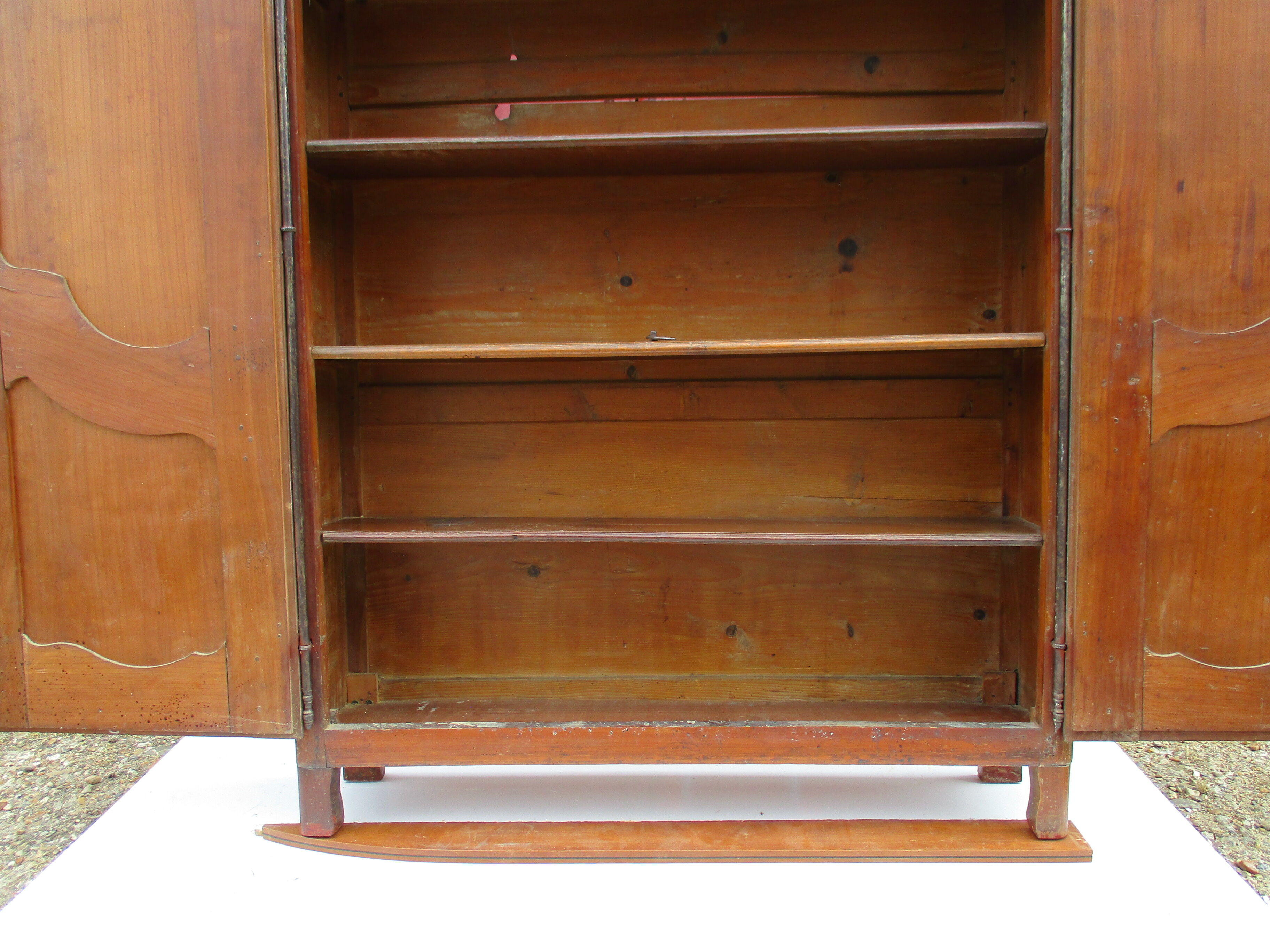 Small solid wooden cabinet with a gendarme hat