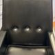 Modernist armchair in wood and black synthetic leather, circa 1960