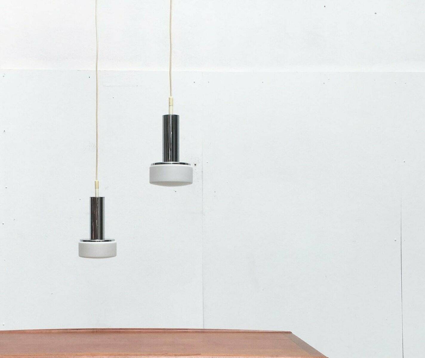 Suspended glass and chrome lamps model P105 German Mid-Century Space Age from the 1960s by Staff, set of 2.