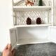 Rattan wall shelf