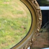 Bevelled oval antique mirror