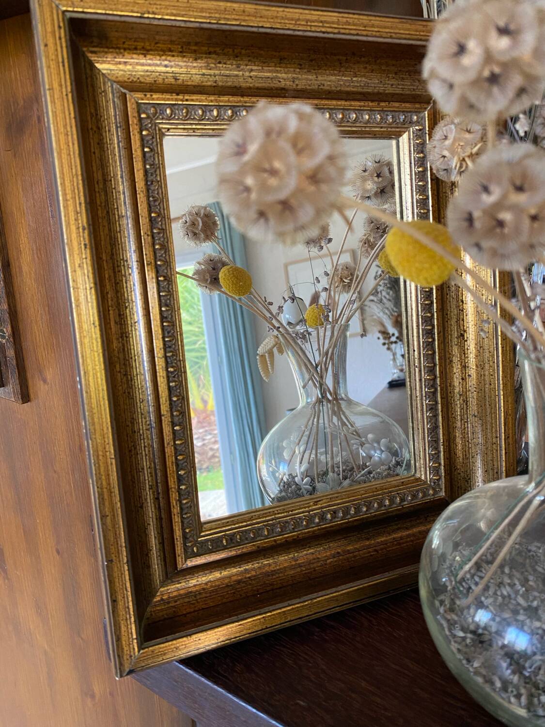 Bronze-colored framed mirror