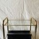 Magazine rack, saddle on vintage wheels