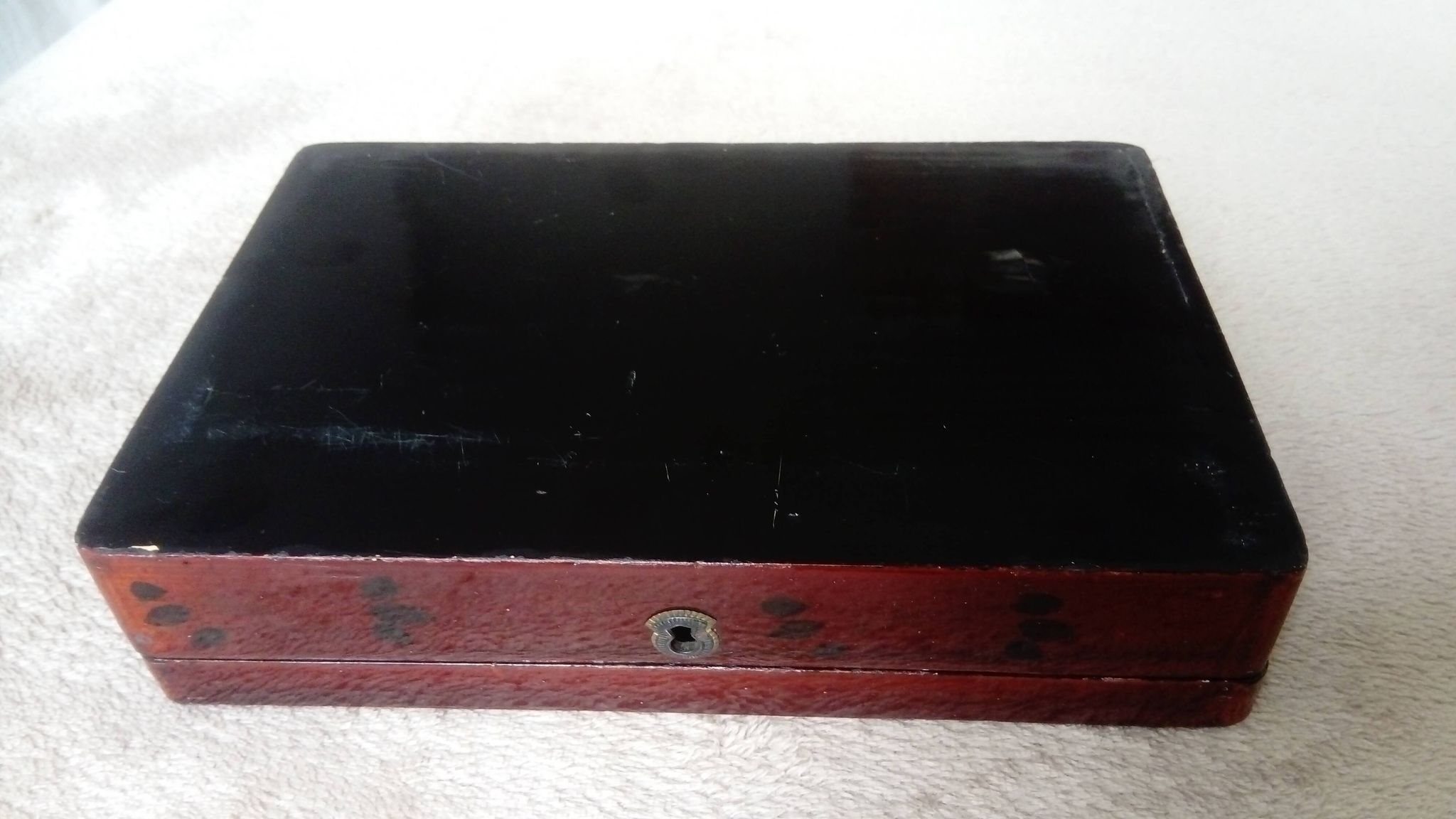 Old lacquered wooden box with china or japan decoration, bird and flower
