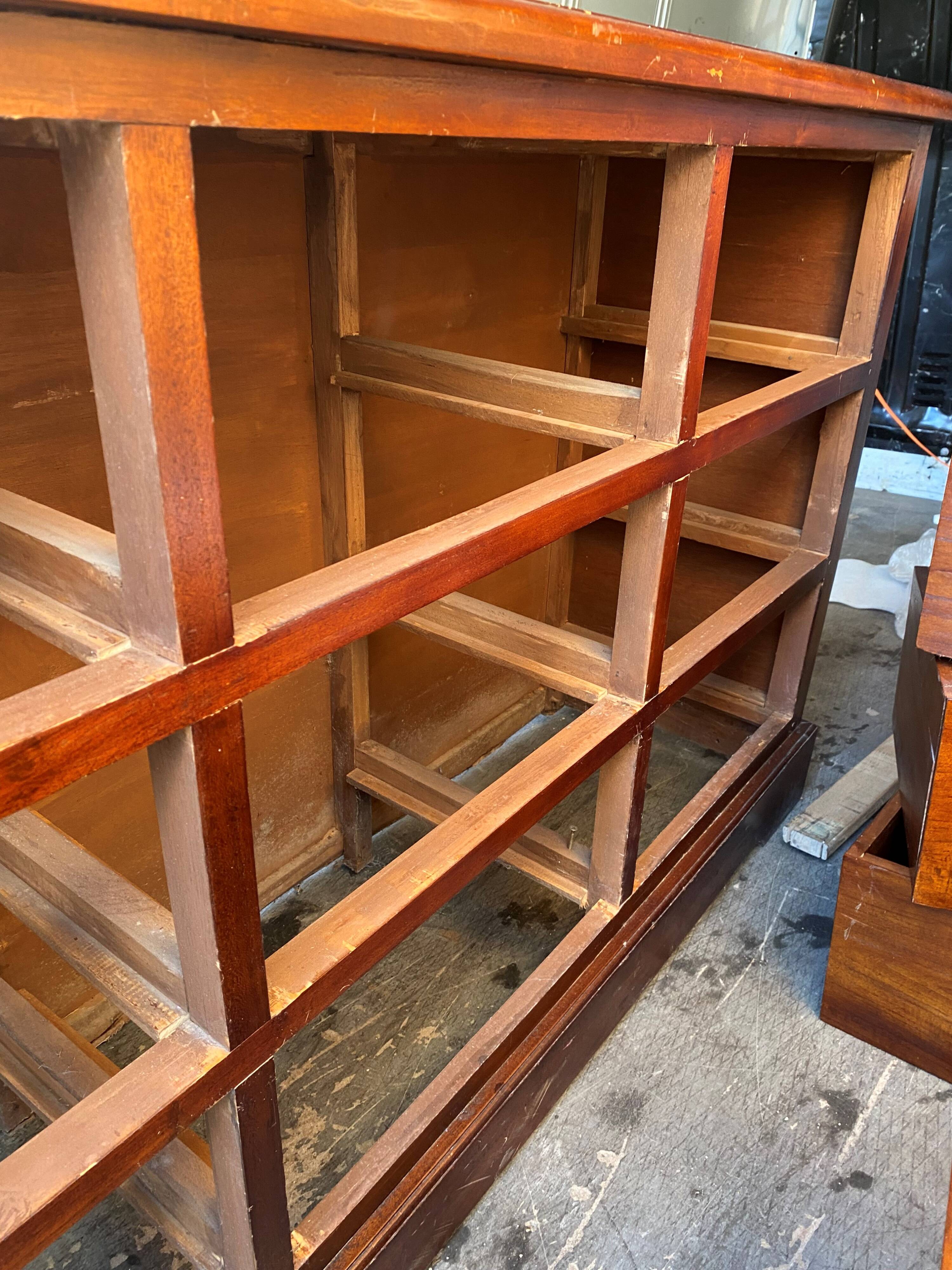 Old and authentic trade storage unit counter with 12 large drawers in cherry wood 1950
