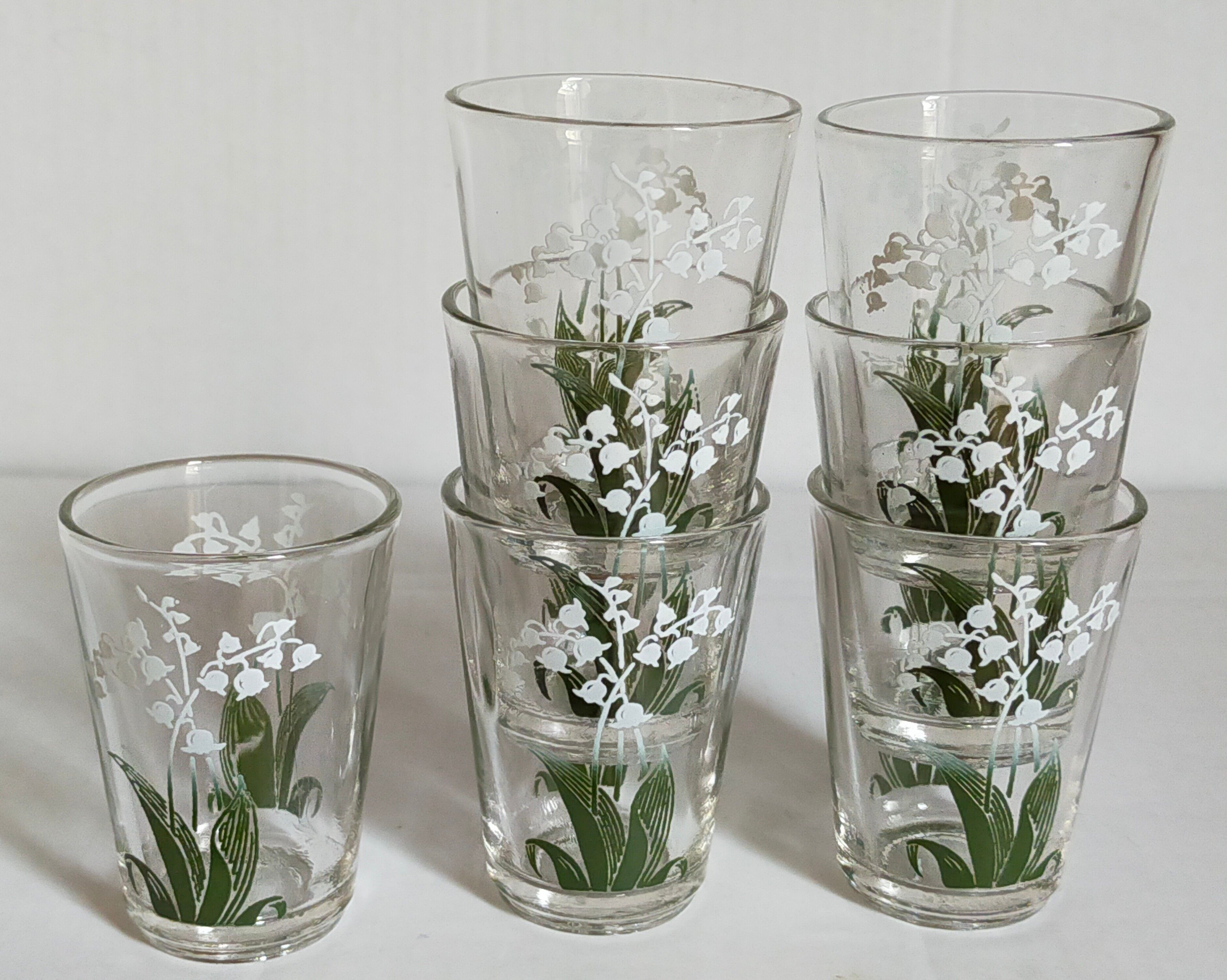 Seven glasses with digestive screen-printed with thrush, 30s