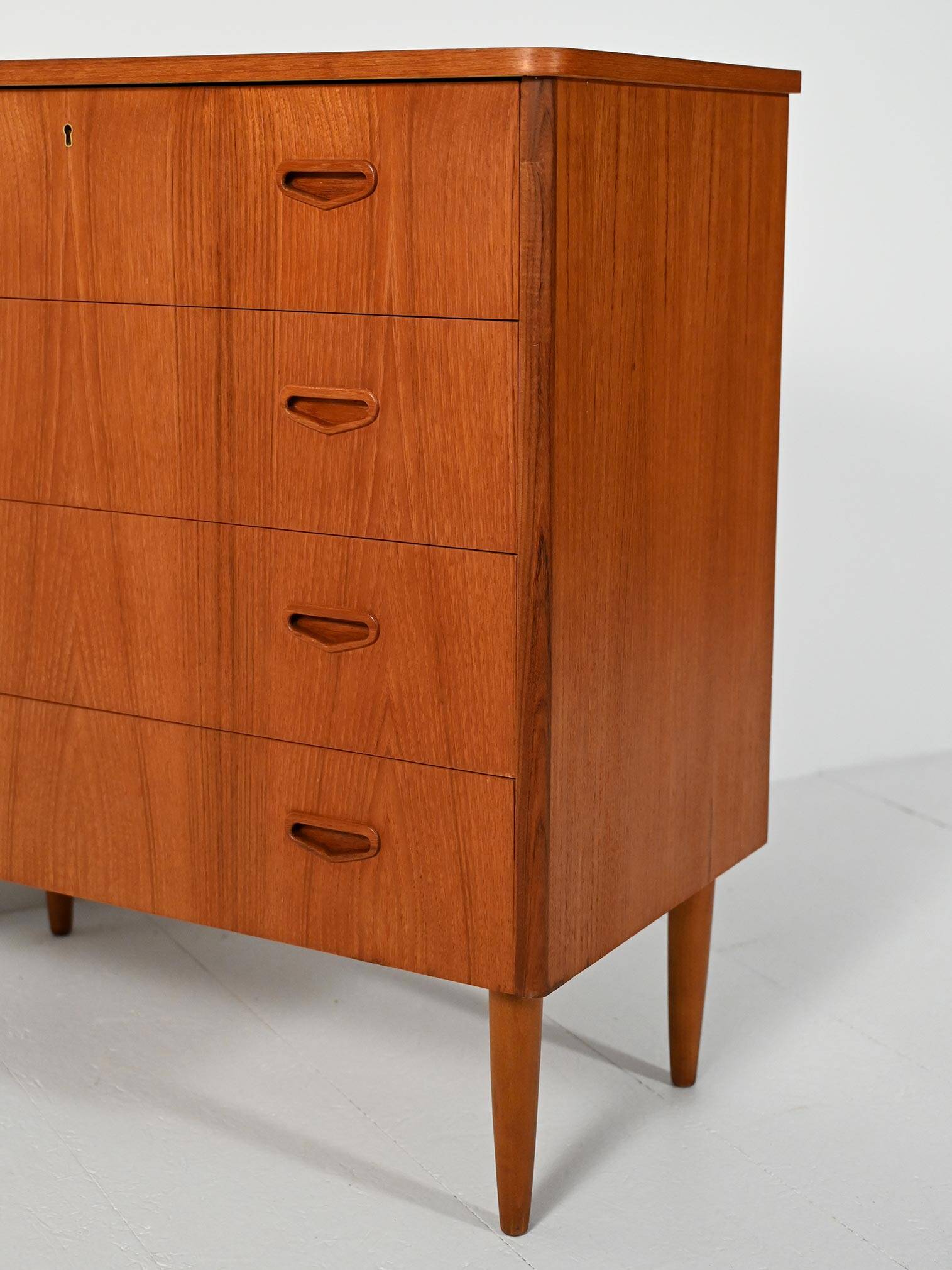 Scandinavian teak chest of drawers with sculpted recessed pulls