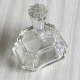 Small transparent faceted glass bottle
