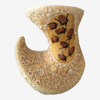 Ceramic vase with volcanic mustard yellow glaze on a white base