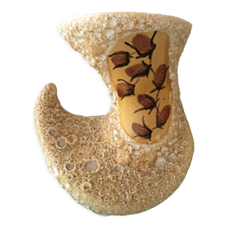 Ceramic vase with volcanic mustard yellow glaze on a white base
