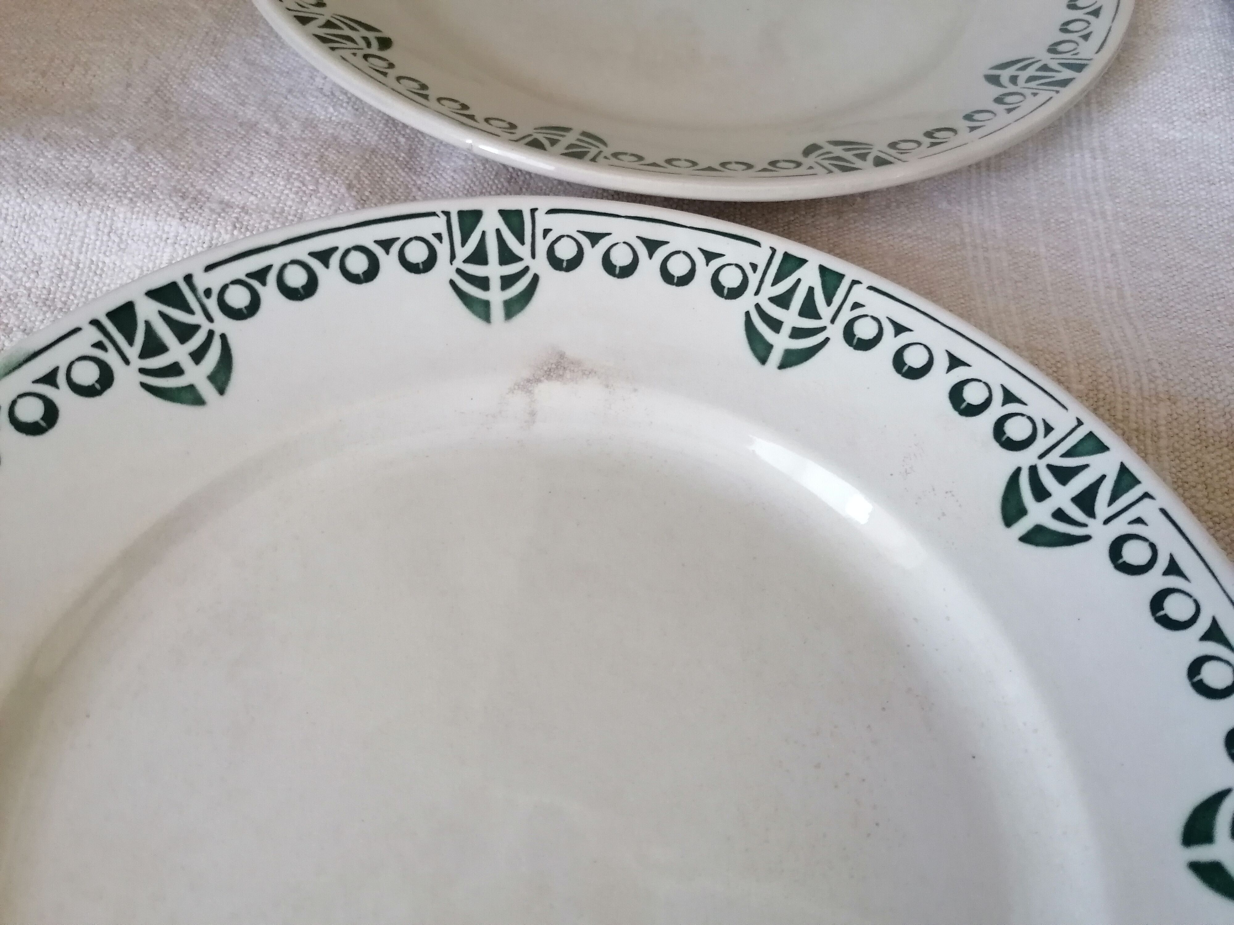 Set of 11 flat earthenware plates