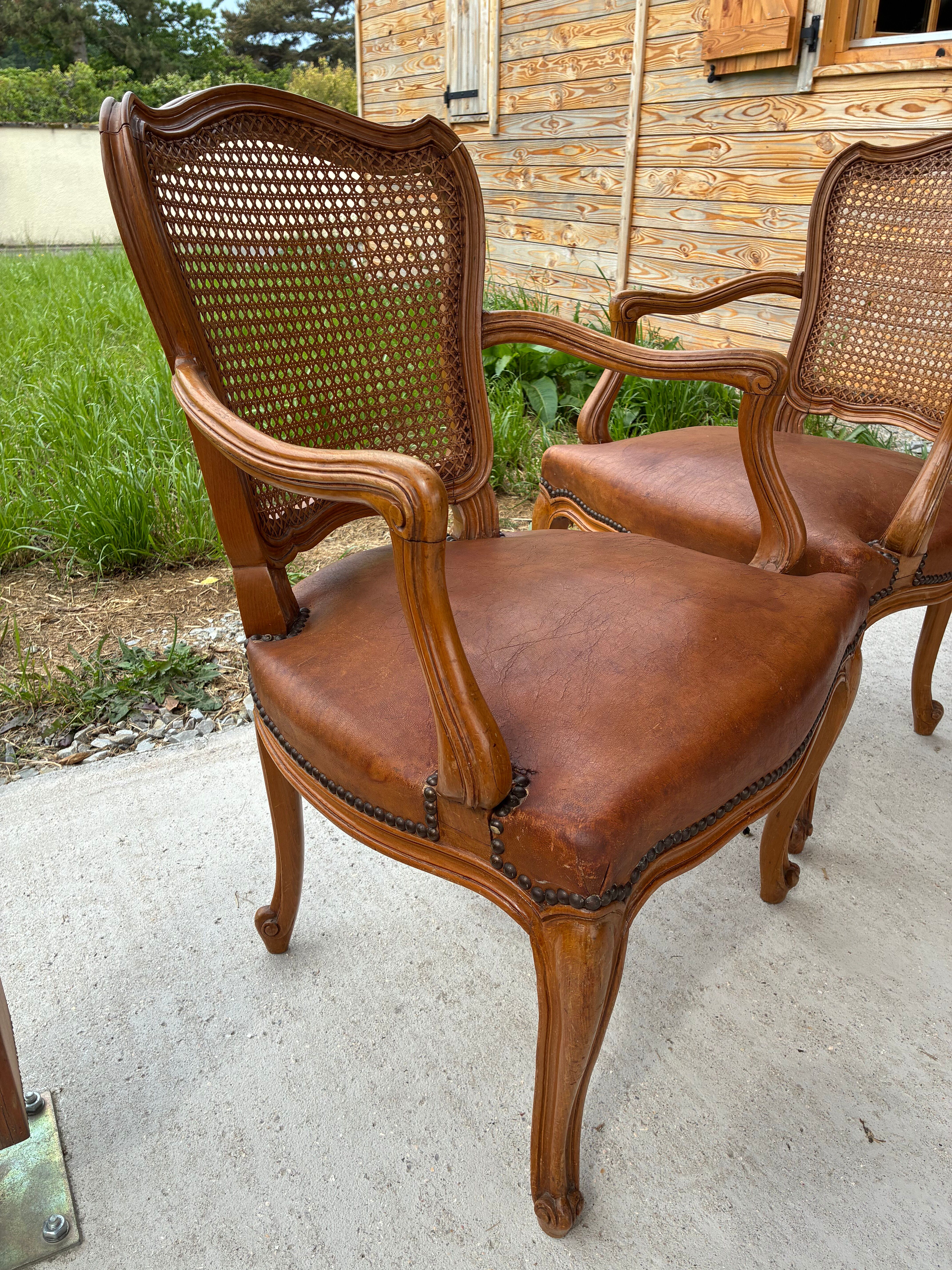 Cane and leather armchair in Louis XV style