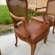 Cane and leather armchair in Louis XV style
