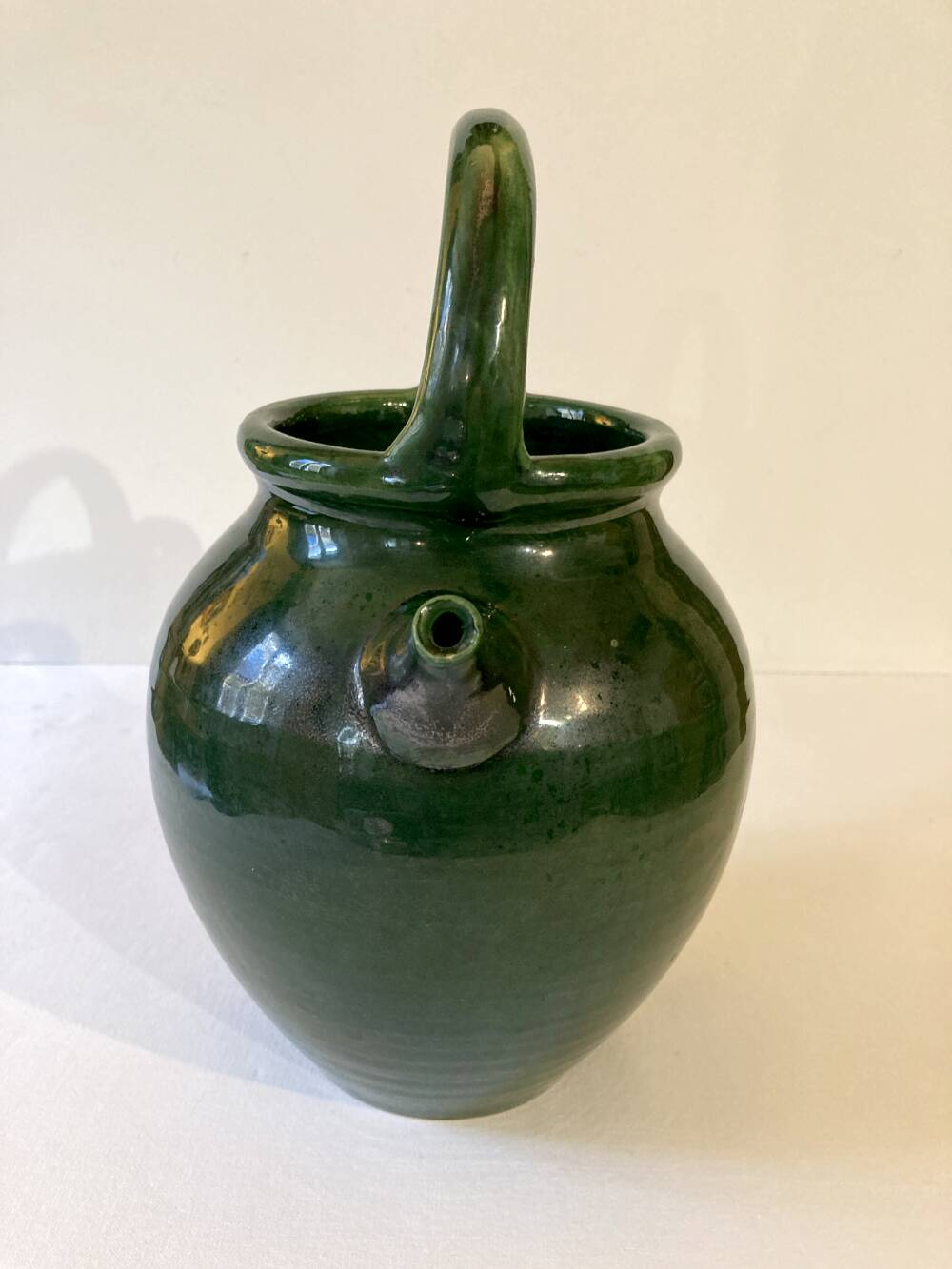 Emerald green glazed terracotta goat jug