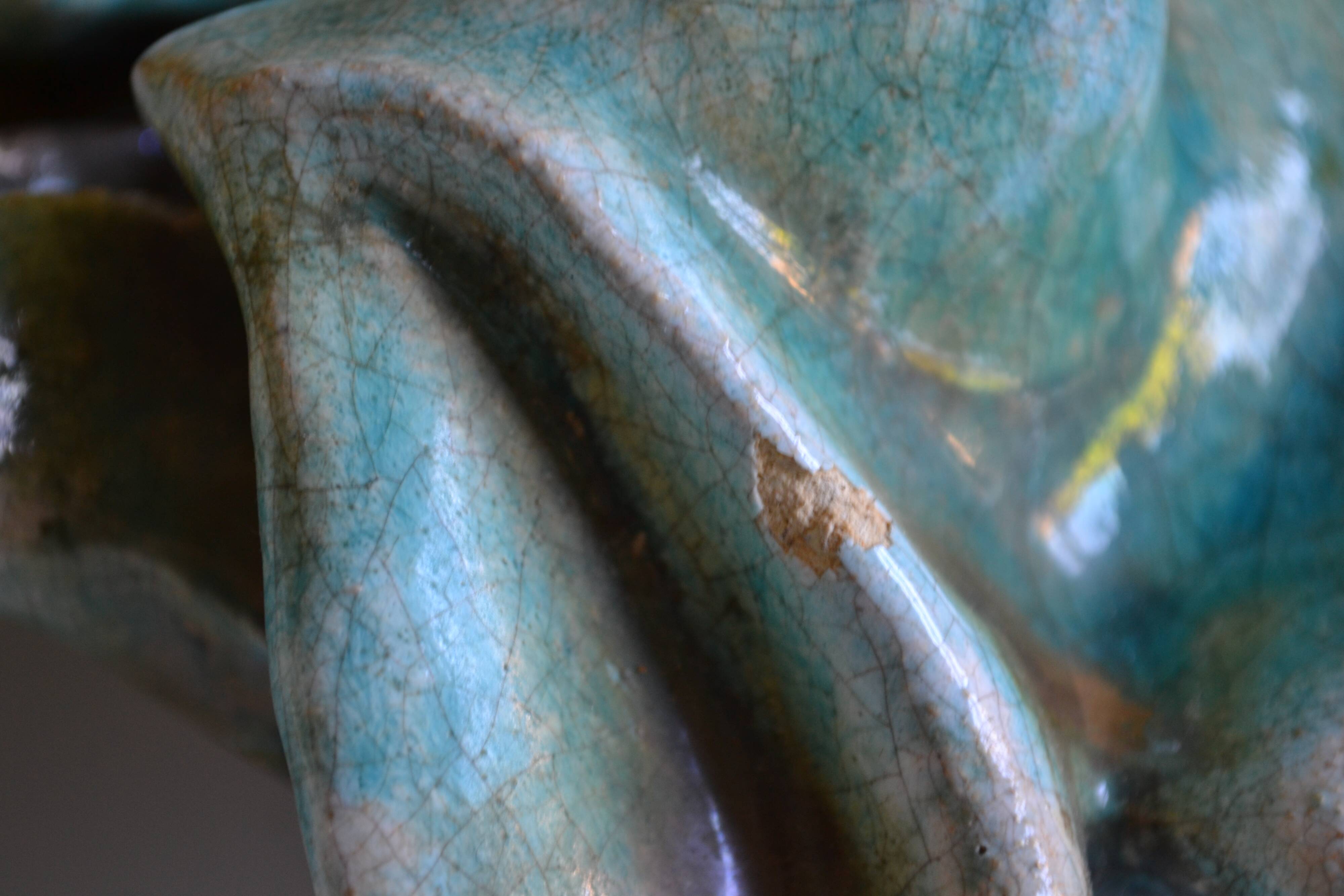 Surreal ceramic sculpture in relief signed to be identified.