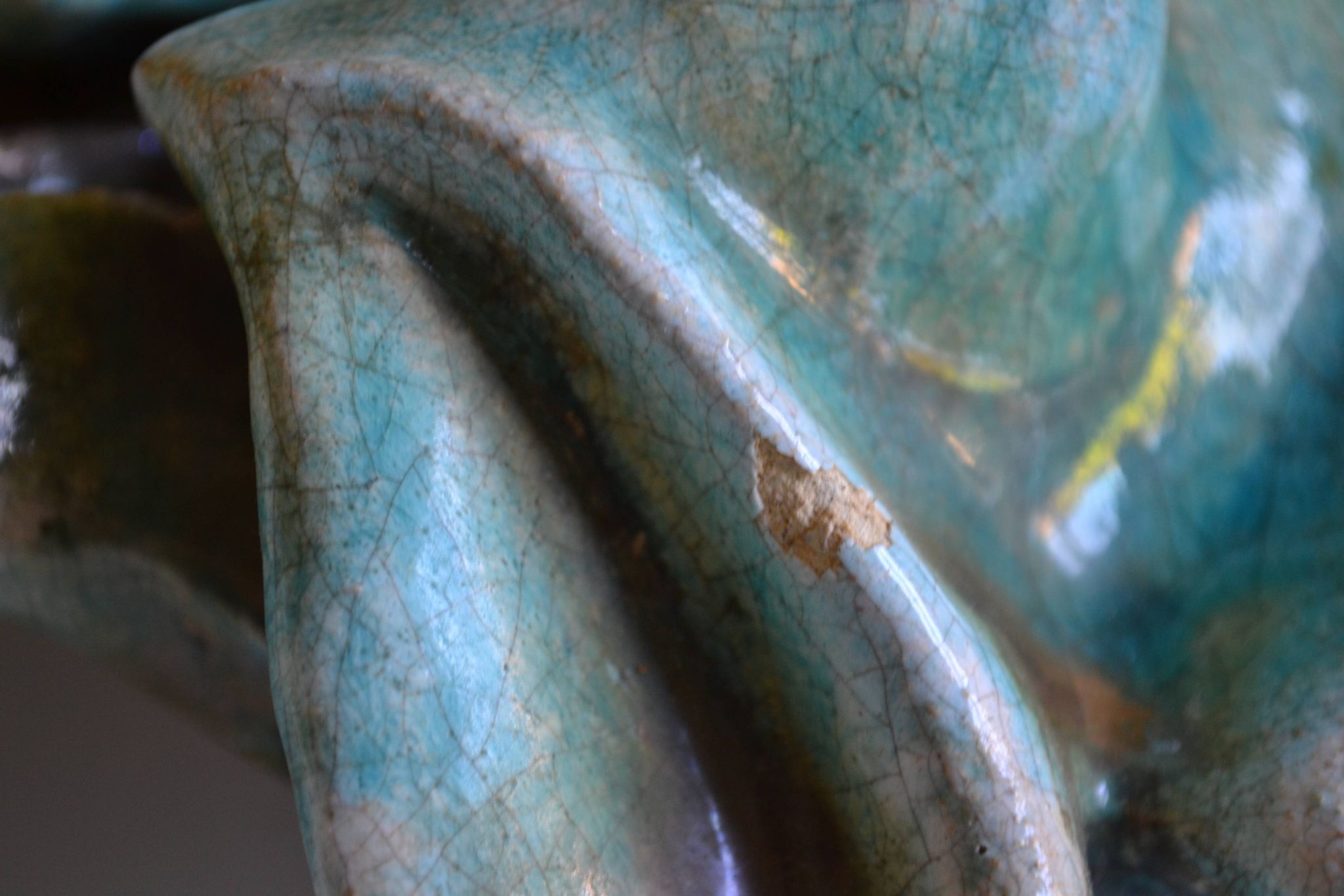 Surreal ceramic sculpture in relief signed to be identified.