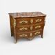 Louis XV period commode with violet wood veneer.