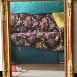 Miroir ancien à moulures dorées