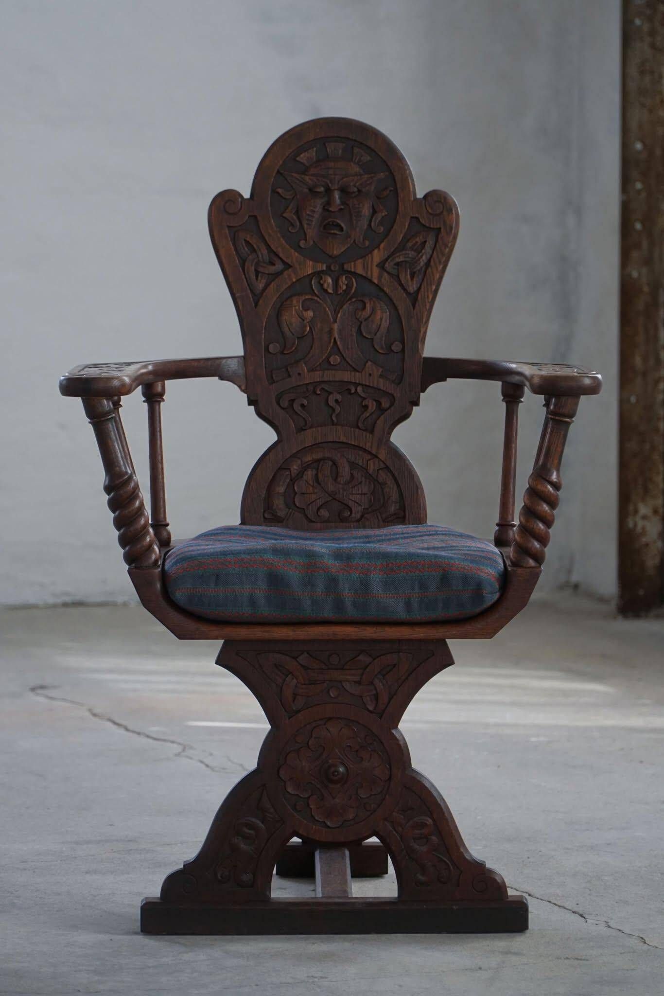 Scandinavian armchair in solid oak with cushion, folk art, early 19th century.