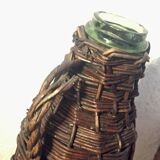 Ancient bottle in wicker