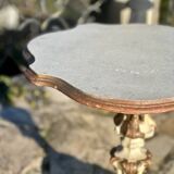 Carved and lacquered wooden side table.