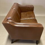 Scandinavian design 2-seater leather sofa.