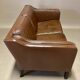 Scandinavian design 2-seater leather sofa.