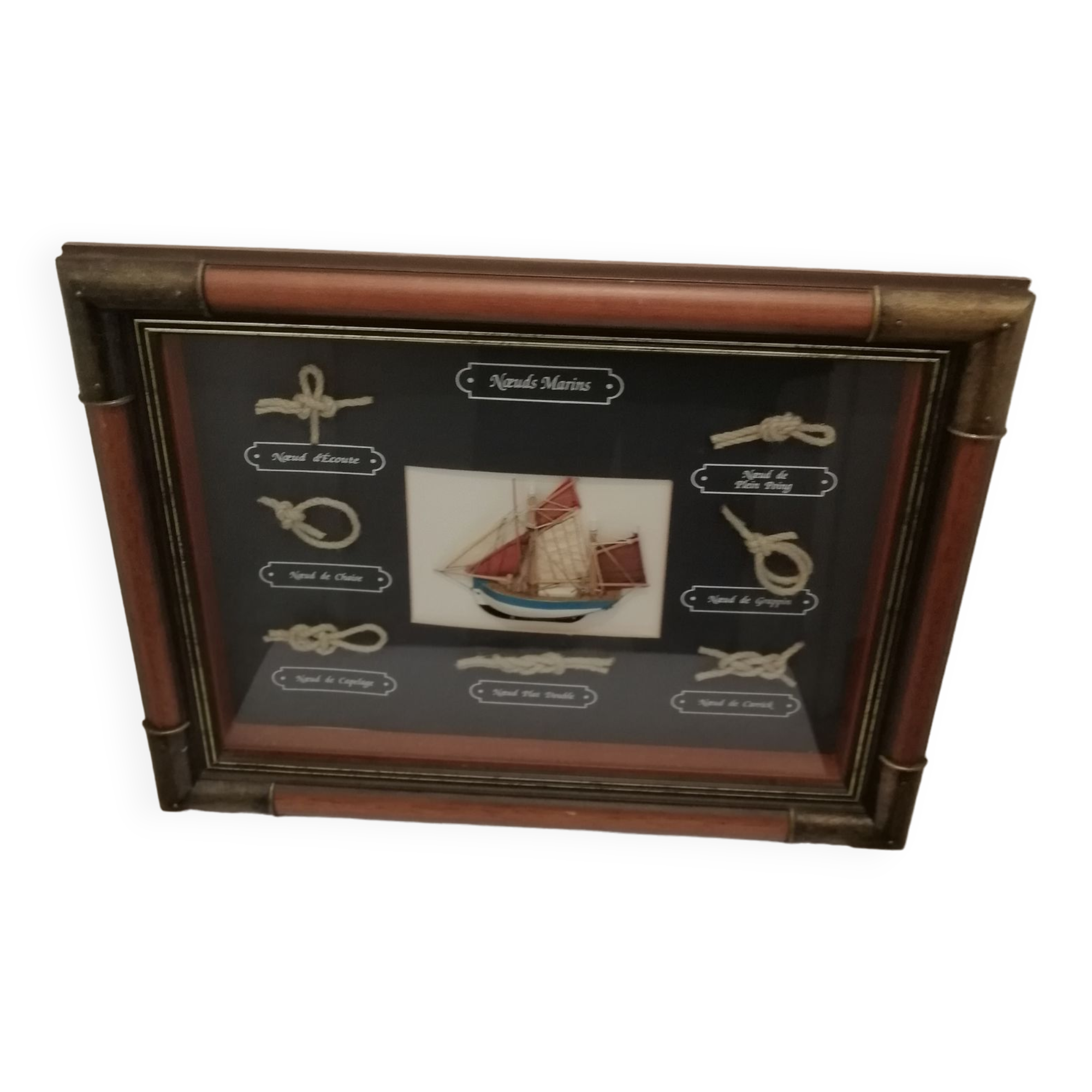 Frame marine knots in wood and brass