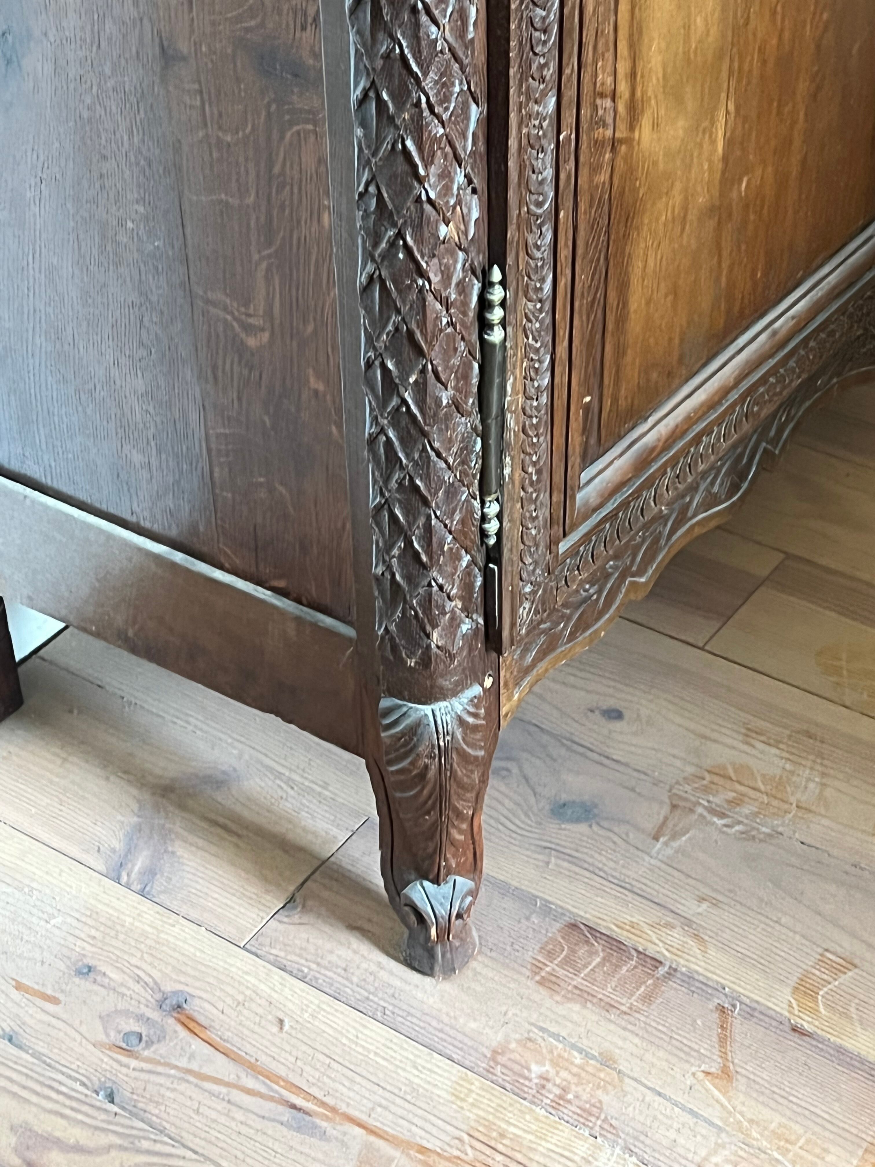 Beautiful and ancient Norman wedding wardrobe, richly carved