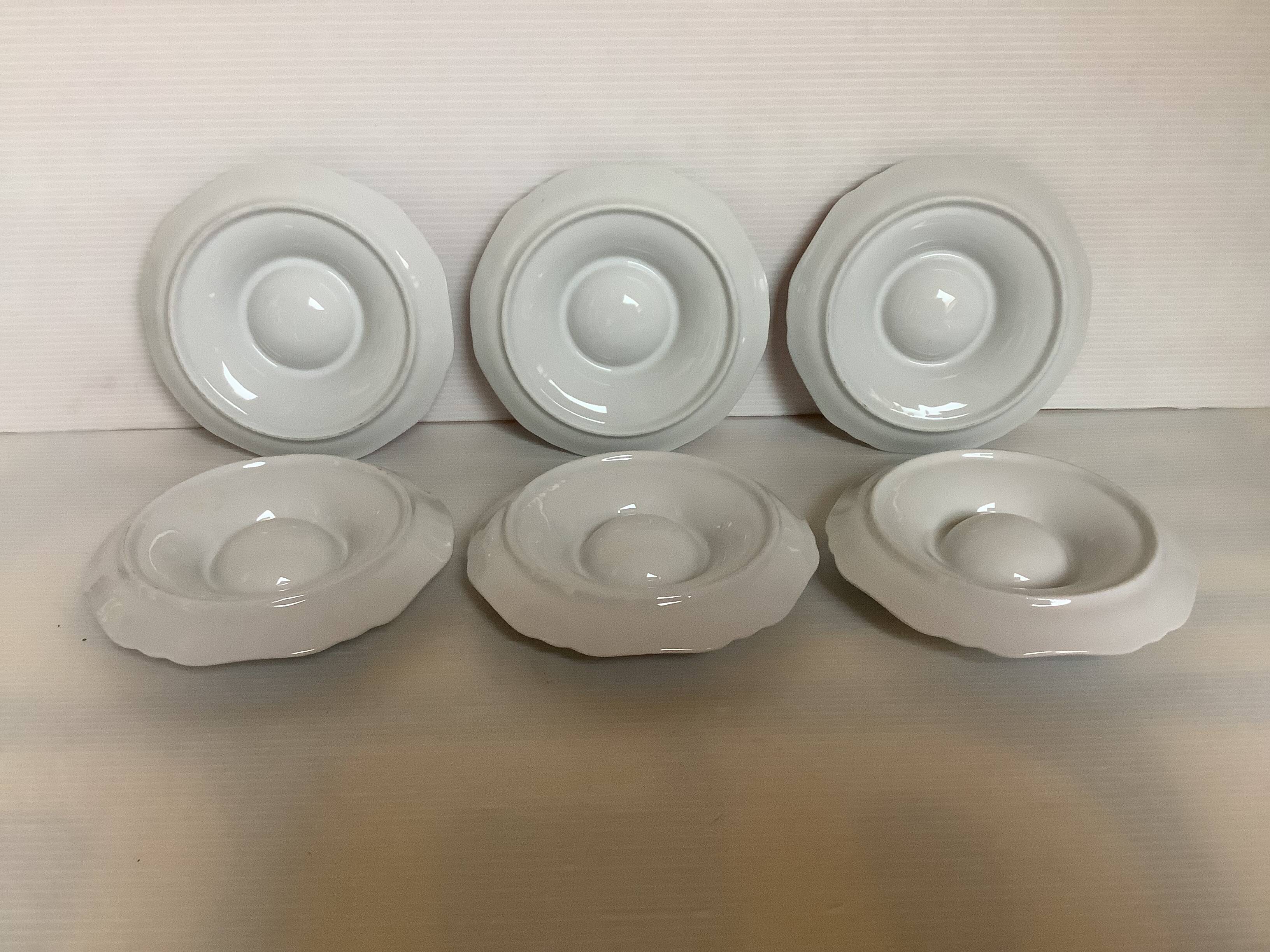 Six egg cups with toile de Jouy flowers