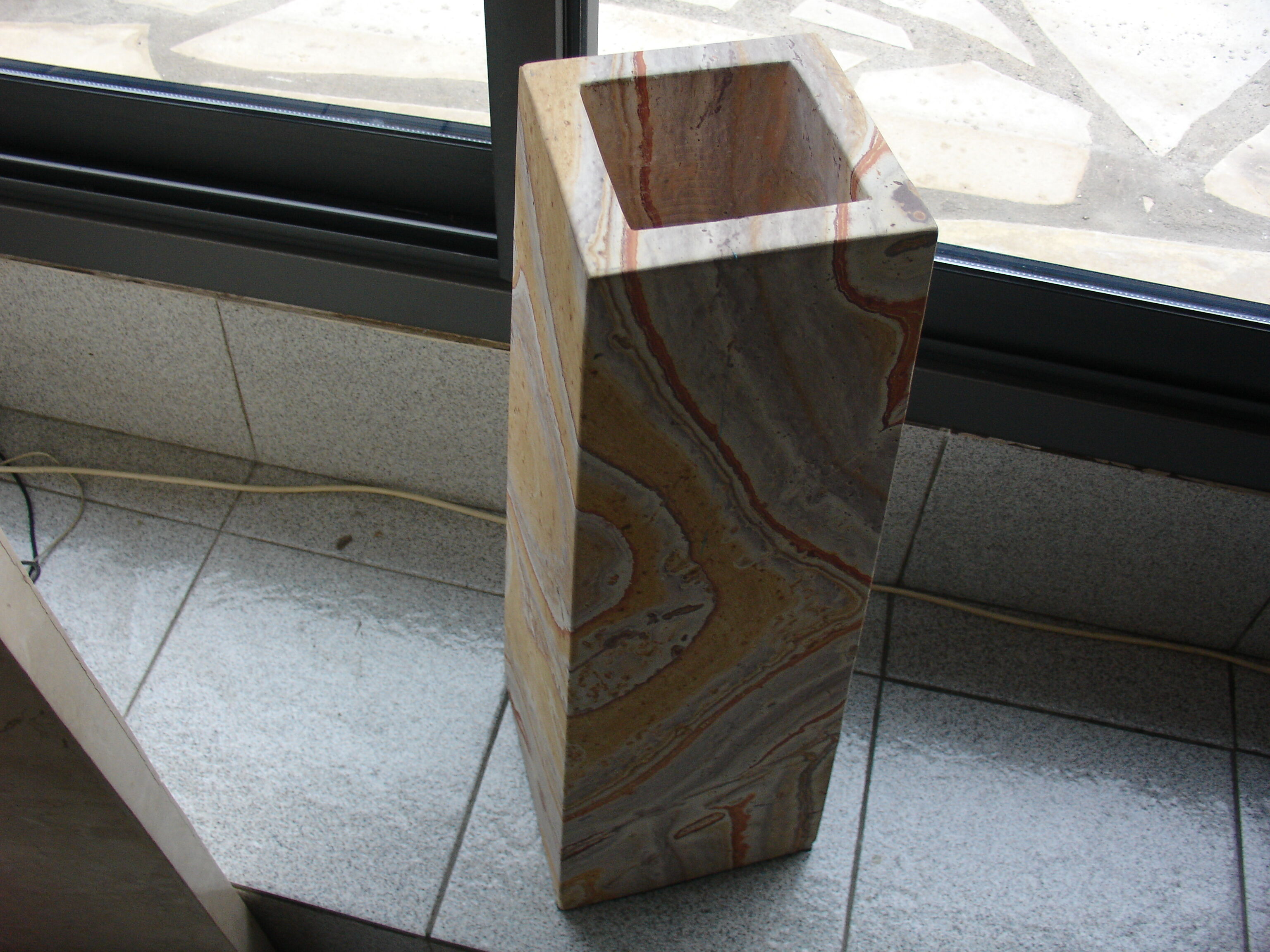 Floor vase in serpentine marble carved from a single block