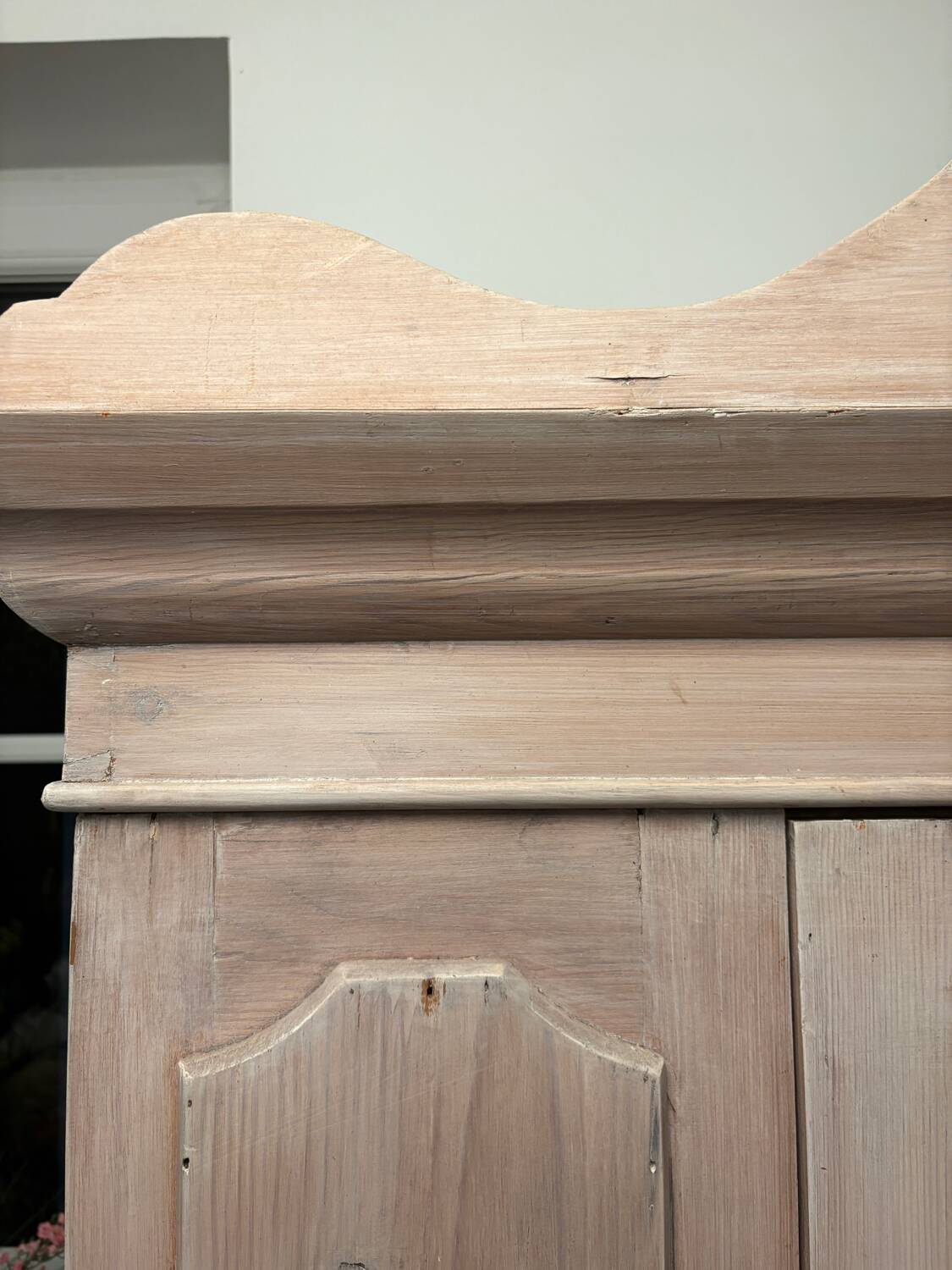 Antique English wardrobe in pale pink patina.