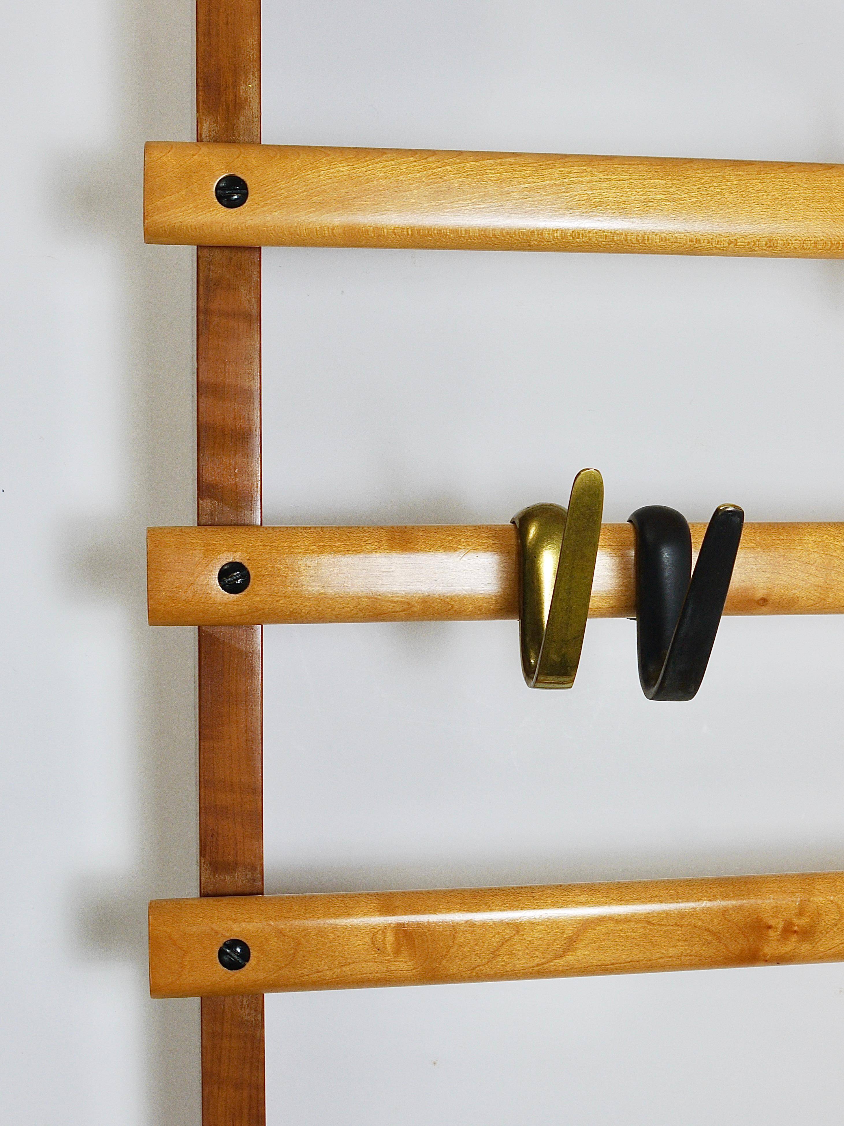 Rare coat rack by Carl Auböck with hat rack, cabinet, brass, walnut and beech, 1950s.