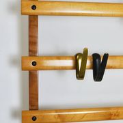 Rare coat rack by Carl Auböck with hat rack, cabinet, brass, walnut and beech, 1950s.
