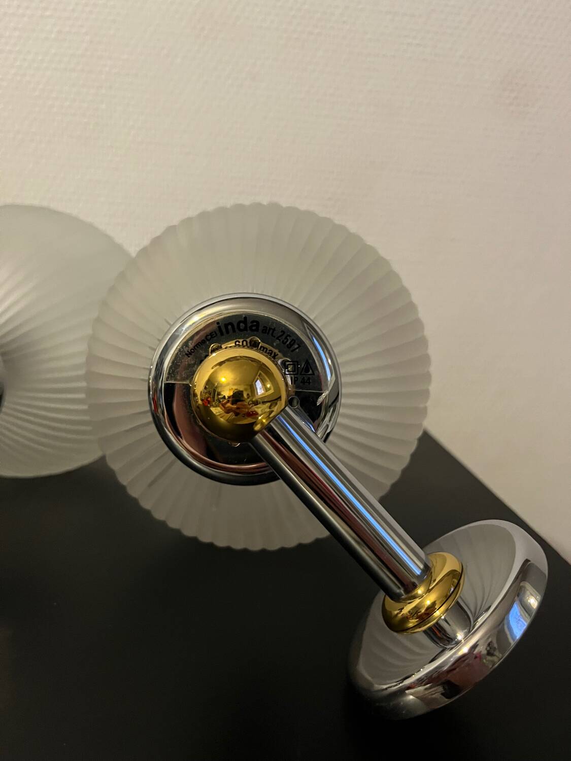 Pair of Inda metal and chiseled glass wall lights