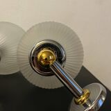 Pair of Inda metal and chiseled glass wall lights