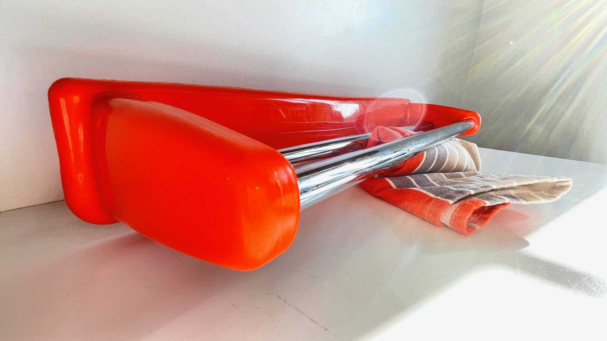 Orange towel rack by Syla from the 70s