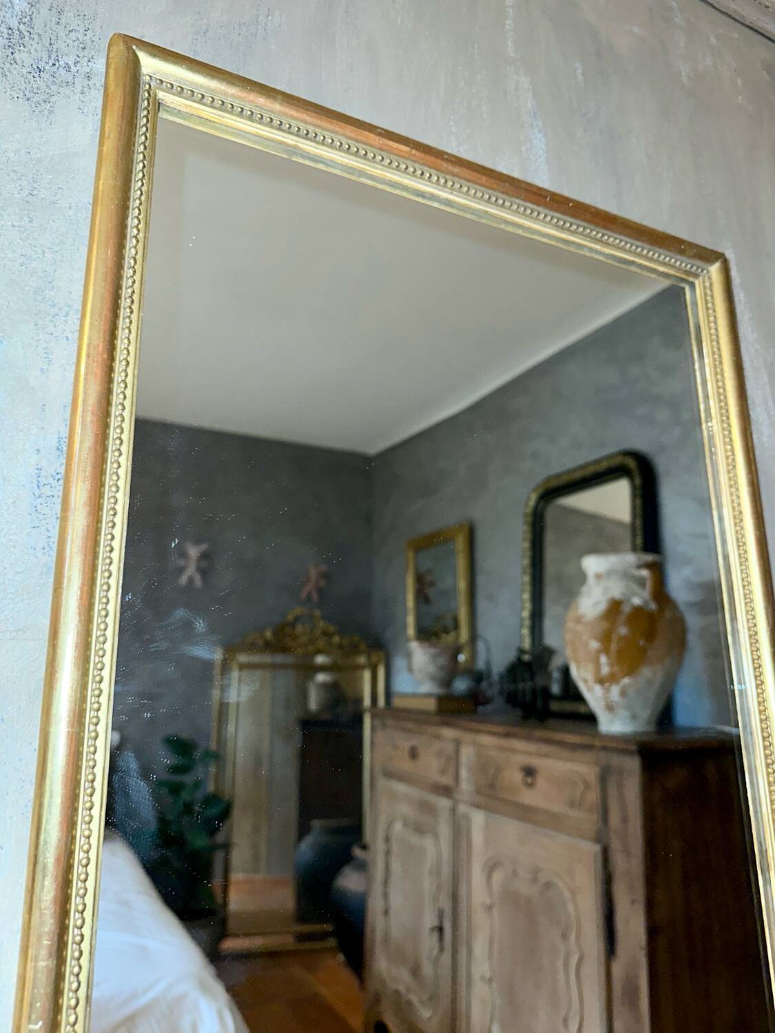 Antique beaded mirror with gold leaf