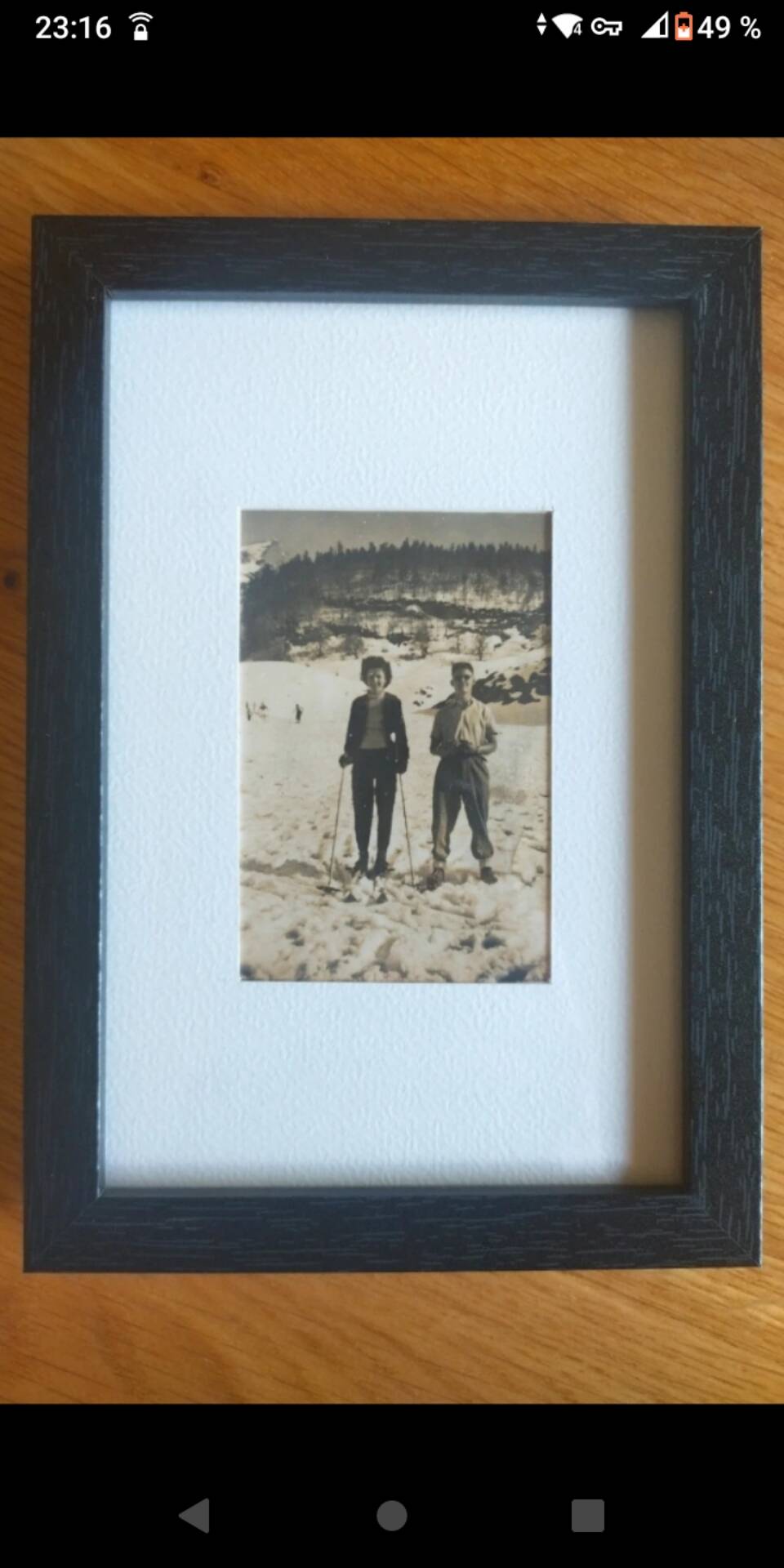 Framed vintage photograph of skiers.