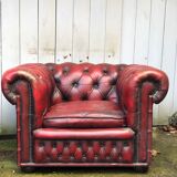 Pair of red leather chesterfield chairs
