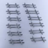 Twelve 70s design metal knife holders