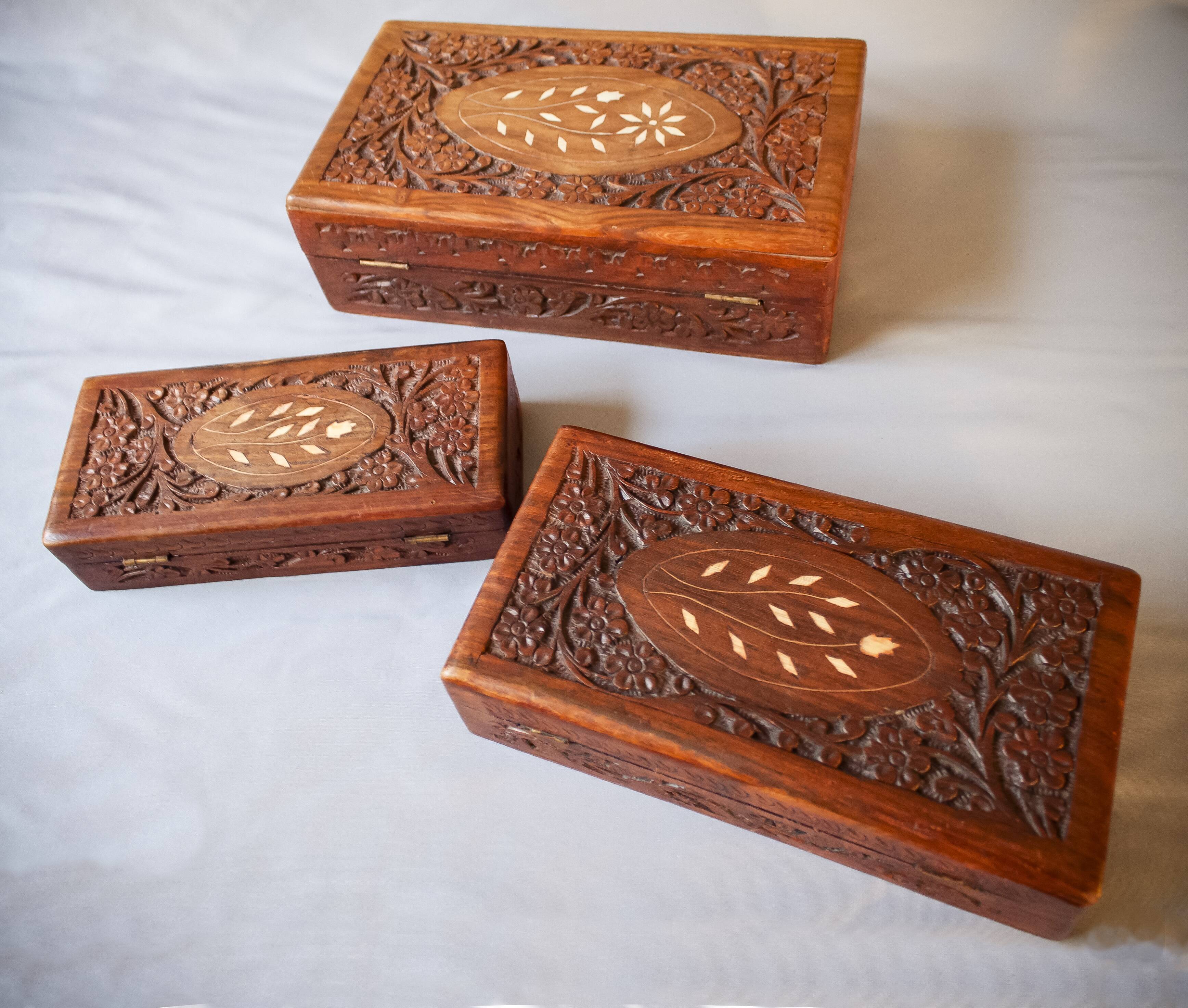 Antique hand-carved wooden boxes.