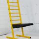 Adjustable seat chair. Circa 1980. Italy. Yellow lacquered steel.