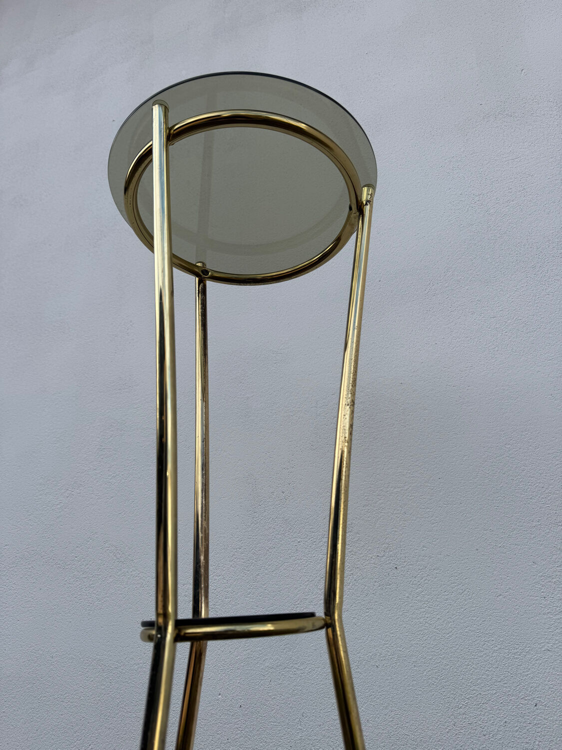 Golden tripod stand with smoked glass from the 1970s.