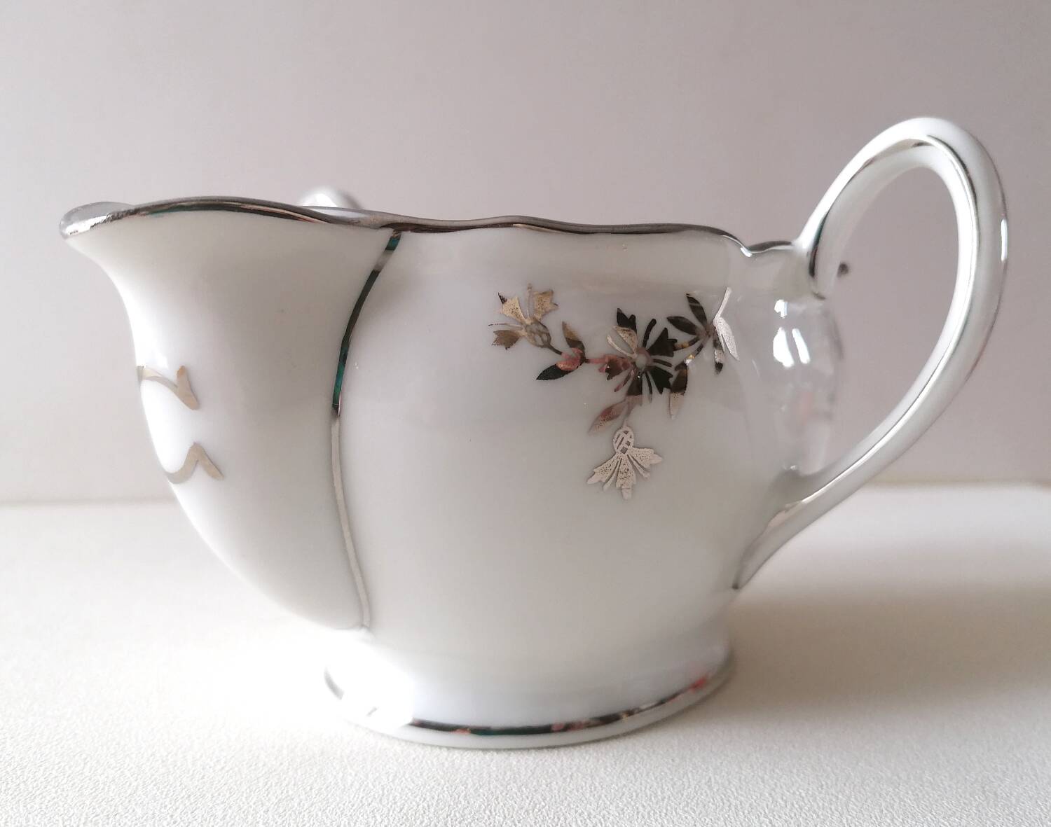Limoges Maigre Gras porcelain sauce boat with silver decoration