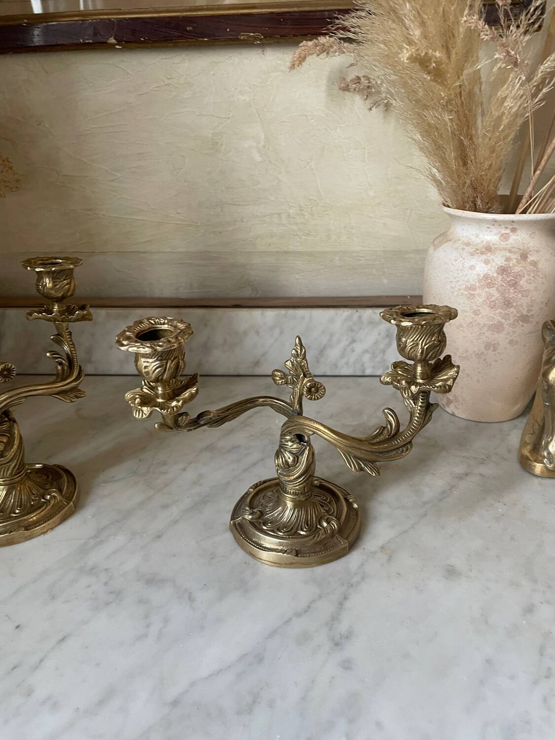 Pair of rocaille candlesticks in gilded bronze