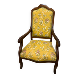 Louis XV style cabriolet armchair in solid wood, yellow floral fabric.